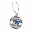 A round decorative ornament with a gray hanging loop, featuring the text 'GETTYSBURG COLLEGE DAD' in navy blue over a distressed white background with horizontal navy and orange dotted stripes.